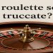 ruota della roulette in legno con scritta "Le roulette sono truccate?"